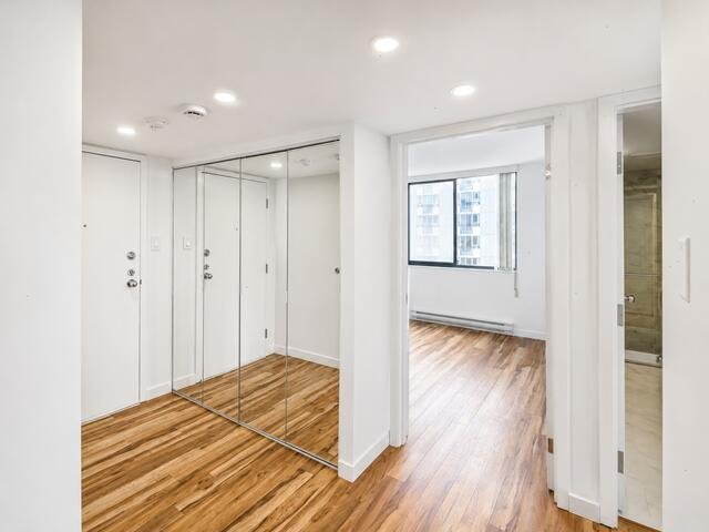 Entry foyer with mirrored closets